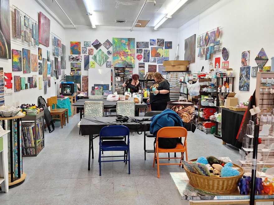 Kayla Burns and her mom Mickey Woolery mix paint as they get ready for a painting class at Books on the Vine.