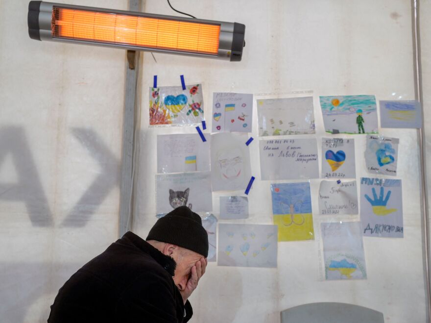 A man rests after his arrival at a hub for displaced people in Zaporizhzhia, some 124 miles northwest of Mariupol, on April 5. Residents of the besieged city have scattered as they evacuate.