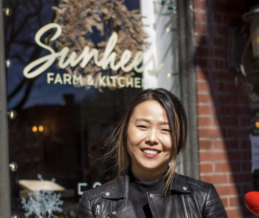 Owner Jinah Ahn in front of Sunhee's Farm and Kitchen in Troy