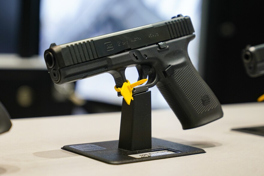 A Glock 45 9mm pistol is shown as guests browse firearms at the National Rifle Association's Annual Meetings & Exhibits in Indianapolis, Sunday, April 16, 2023. (AP Photo/Michael Conroy)