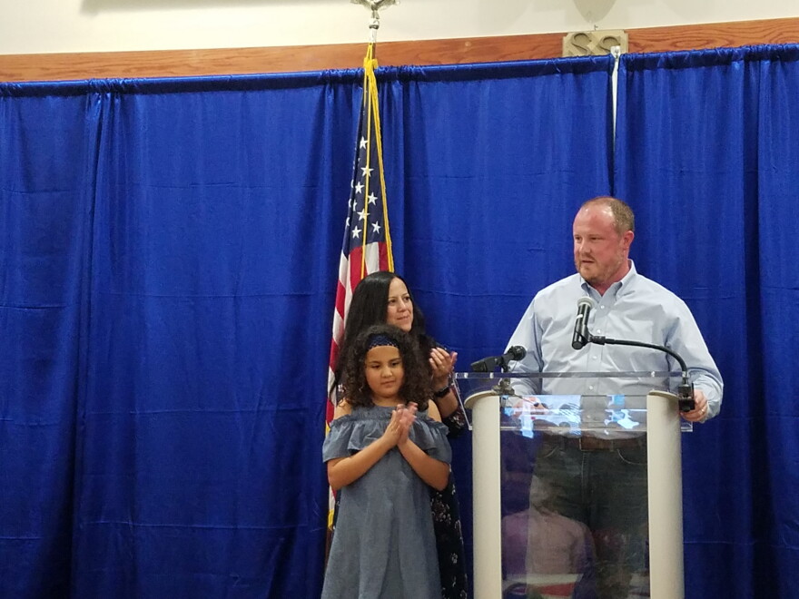 Fort Myers native, Matt Caldwell, gives a speech at his election watch party in North Fort Myers Tuesday night with his wife Yvonne and his 10-year-old daughter, Ava, by his side.