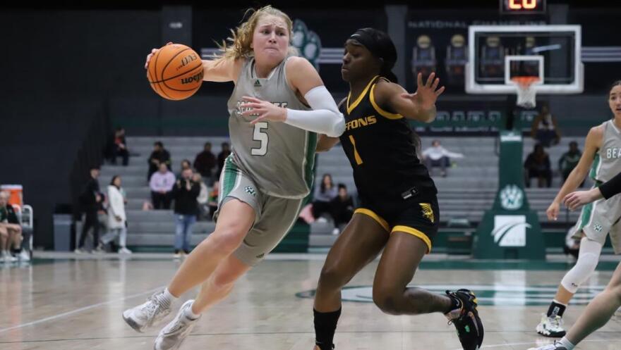 Action shot of Molly Hartnett vs Missouri Western basketball
