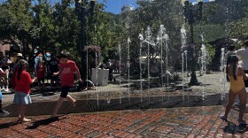 Kids play in the fountains on Aspen’s pedestrian mall during Fourth of July festivities.