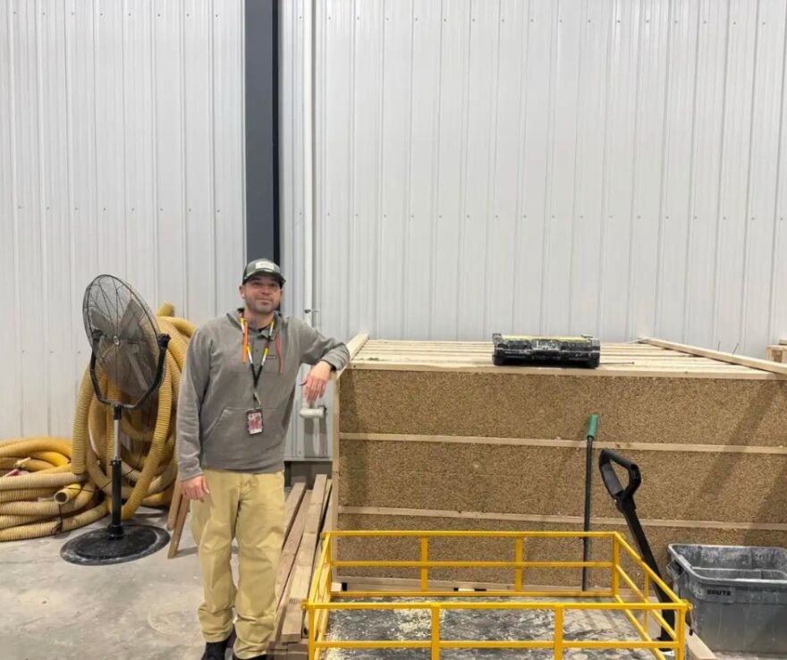 Danny Dejarlais, who runs the Lower Sioux Indian Community’s hempcrete business, points out hempcrete blocks manufactured and stored in its warehouse on the reservation | MPR News