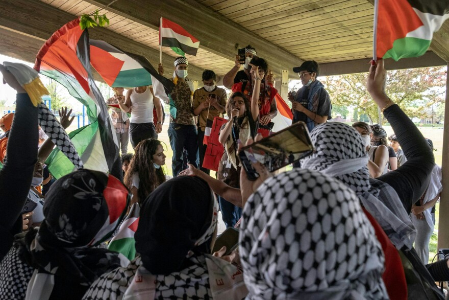 Protesters objecting to U.S. policy toward Israel gather Tuesday at Lapeer Park in Dearborn, Mich., during a visit by President Biden to a nearby Ford Motor Company plant.