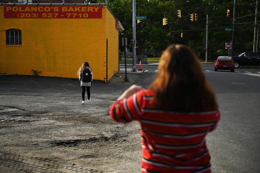 Glenda Cardenas walks both her children the 5 blocks to school every day. With Nathaly Torres it's to her bus stop for middle school but Nathaly usually Makes the trip a little faster than her mom. Waterbury, Connecticut June 02, 2021.