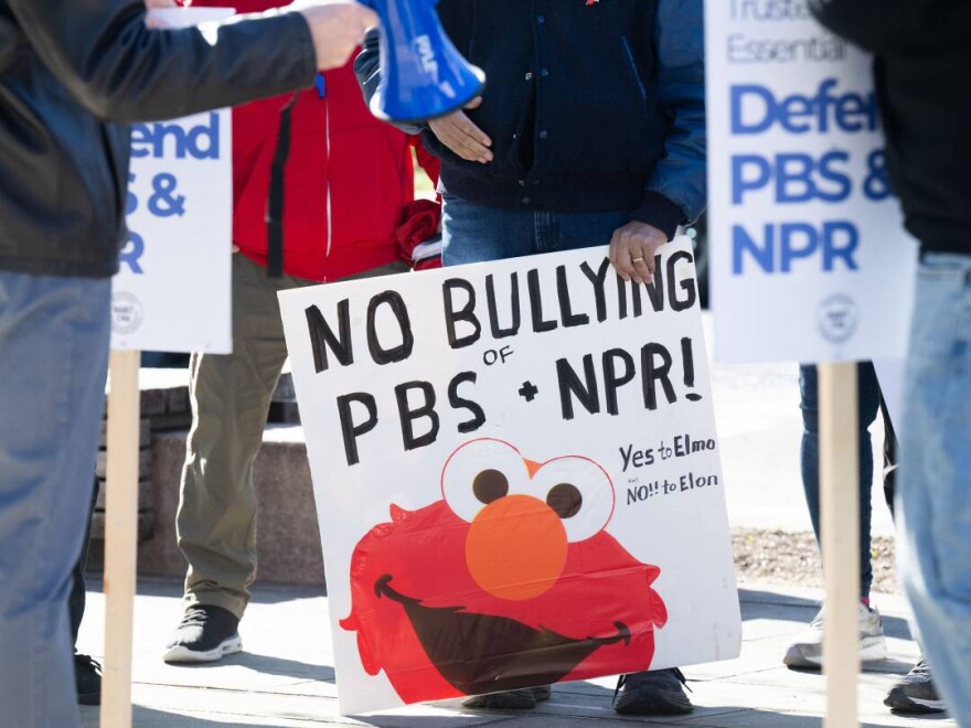 People participate in a rally to call on Congress to protect funding for public broadcasters PBS and NPR outside the NPR headquarters in Washington, DC, on March 26, 2025.