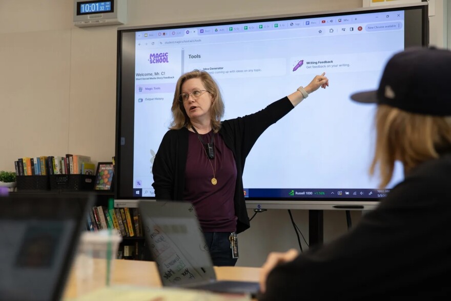 English teacher Jen Roberts explains to her students how she uses Magic School, an AI platform, for classroom exercises and grading at Point Loma High School in San Diego on May 3, 2024.