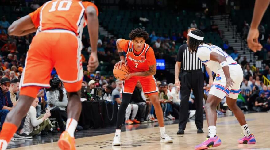 Kiyan Anthony (7, Orange) staring at a defender on the wing