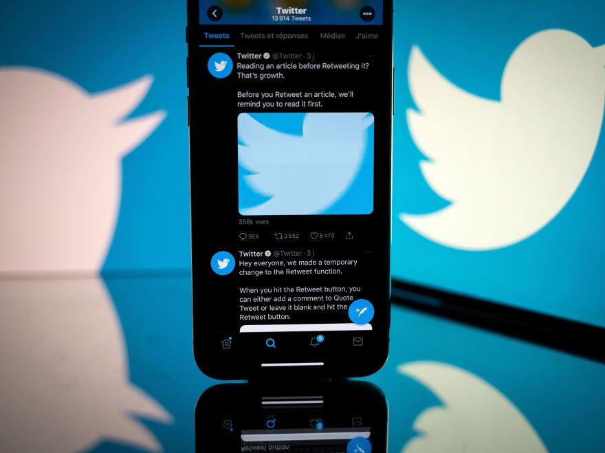 This photograph taken on October 26, 2020 shows the logo of US social network Twitter displayed on the screen of a smartphone and a tablet in Toulouse, southern France. (Photo by Lionel BONAVENTURE / AFP) (Photo by LIONEL BONAVENTURE/AFP via Getty Images)