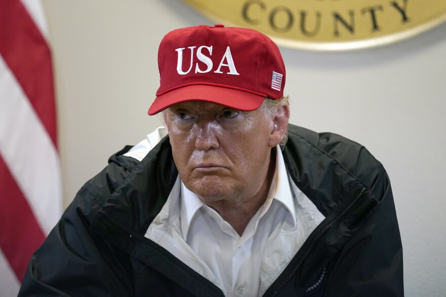 President Donald Trump listens during a briefing about Hurricane Laura with first responders at the emergency operations center Saturday, Aug. 29, 2020, in Orange, Texas. 