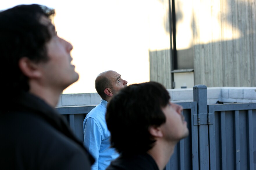 Chris Anderson and others at 3D Robotics looking up at a drone.