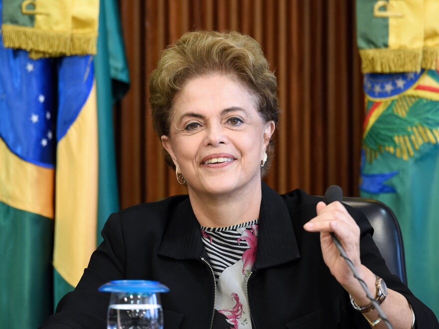 Brazilian President Dilma Rousseff, shown here at a meeting with rectors of public universities in Brasilia on March 11, is facing impeachment proceedings over her handling of the economy.