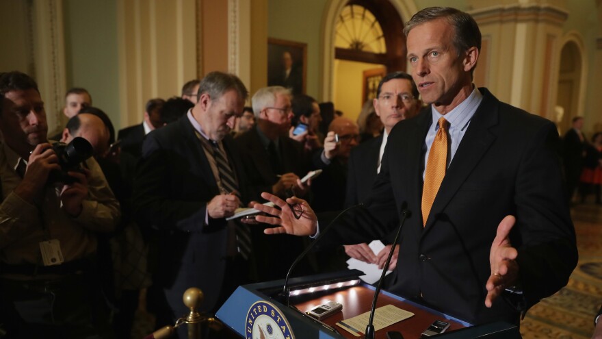 Sen. John Thune talks with reporters following the Republicans' weekly policy luncheon at the U.S. Capitol.