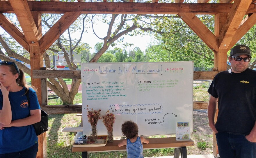 Visitors gather at a community open house hosted by the Montezuma School to Farm Project. The event gave community members a chance to tour the garden and learn about volunteer opportunities.