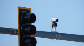 Image of a traffic camera at a red light watching roadway