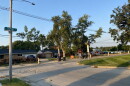 Landscape of Empire Street with construction cones along the roadside. Bloomington High School can be seen in the distance.