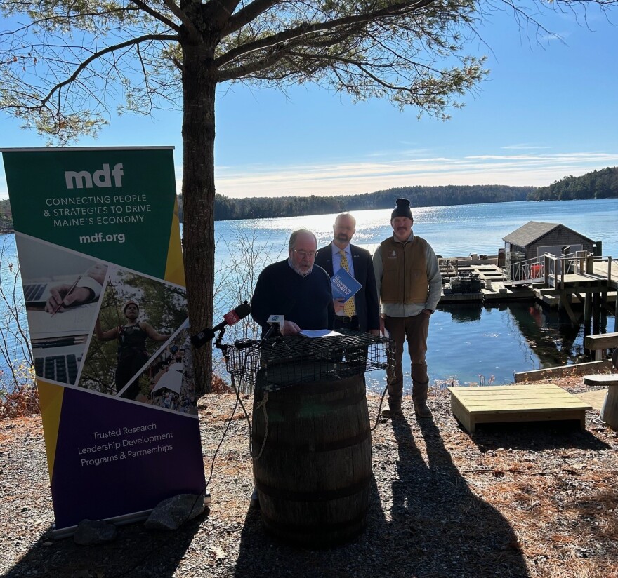 Steve Von Vogt, Co-chair of Maine Economic Growth Council; Yello Light Breen, President of Maine Development Foundation; and Ryan McPherson, owner of Glidden Point Oyster Farm present the annual Measures of Growth report Wednesday at the oyster farm.
