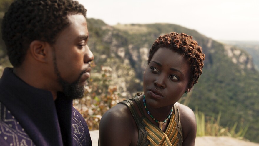 L to R: Chadwick Boseman as T'Challa/Black Panther and Nakia (Lupita Nyong'o) in <em>Black Panther.</em>