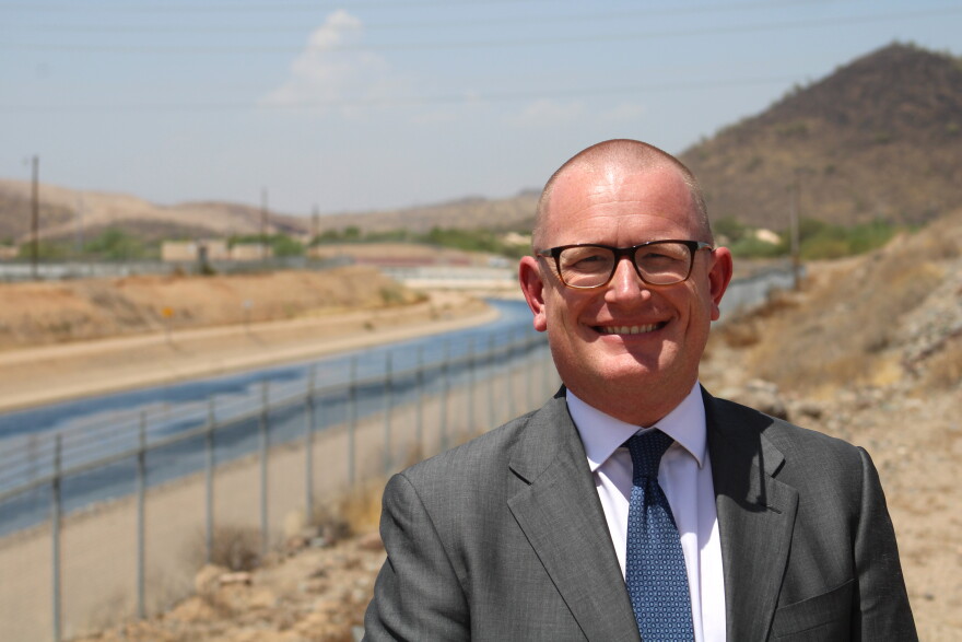 Max Wilson, water resources management advisor for the city of Phoenix, poses next to the Central Arizona Project canal in north Phoenix on August 24, 2026. Wilson said the next round of infrastructure projects needed to adapt to a drier future will be expensive, and ratepayers will foot the bill.