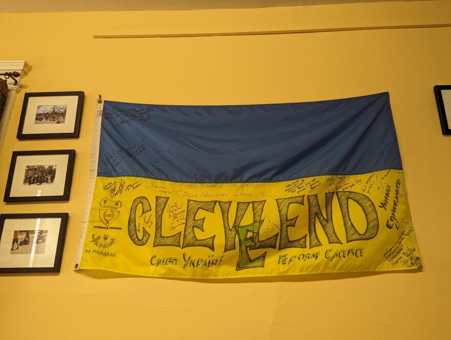 A Ukrainian flag with Cleveland written across the bottom hangs inside the Cleveland Maidan Association.