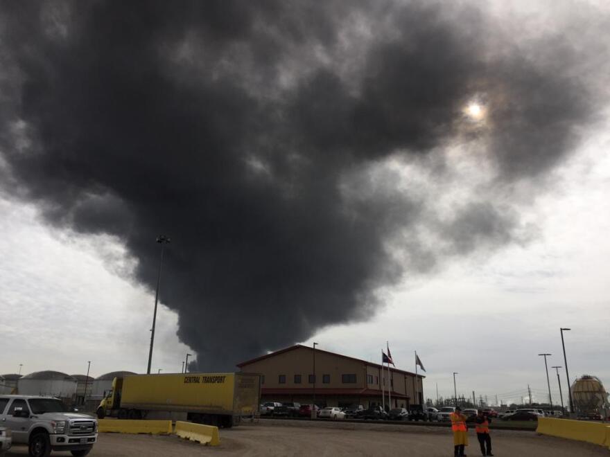 A large black plume of smoke