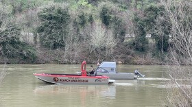 Rescue crews search the South Umpqua River after a man was washed downstream Friday.