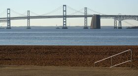 The Chesapeake Bay Bridge can be seen from the beach at Sandy Point State Park, on March 17, 2017 in Skidmore, Md. Under President Trump's 2018 budget proposal, federal funding for the Chesapeake Bay Program that focuses on reducing pollution in the bay would be eliminated. (Mark Wilson/Getty Images)