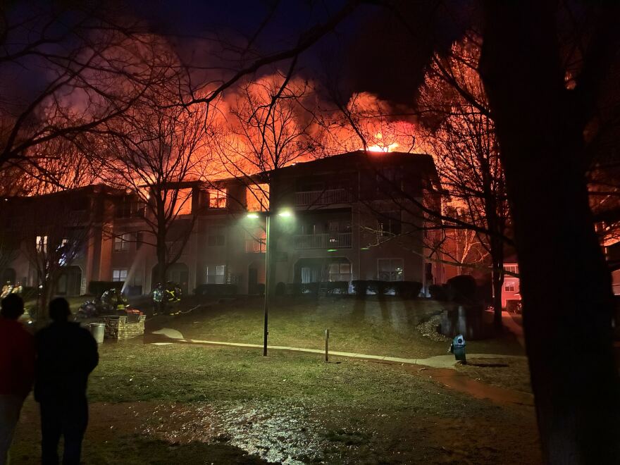 Firefighters work to put out a fire on the third floor of a building at Camden Westwood apartments in Morrisville on February 23, 2026