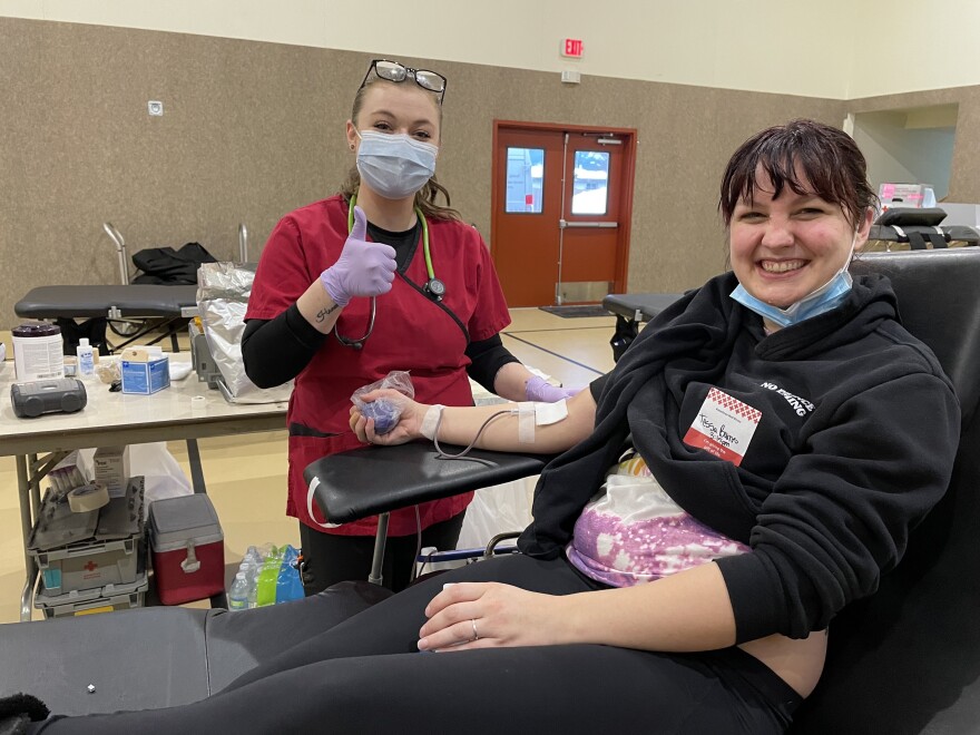 Tessa Burns donates blood at an American Red Cross event in Columbia Falls, MT, January 11, 2022.