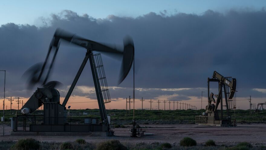 Pump jacks operate at dusk near Loco Hills in Eddy County, New Mexico, on April 23. U.S. oil producers are grappling with prolonged low oil prices and the uncertainty created by the coronavirus pandemic.