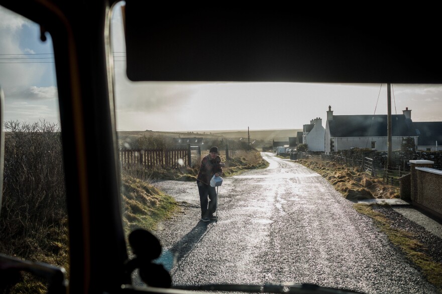 Donald MacLeod, 71, waits for the mobile library. It is his second time using the service. He suffers from a sore leg that makes it difficult for him to walk. The mobile library service was recommended to him by the National Health Service.