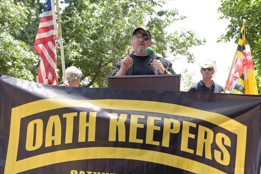 Stewart Rhodes, founder of the Oath Keepers, center, speaks during a rally outside the White House in Washington, June 25, 2017.