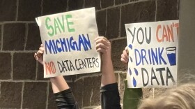 Hundreds of residents, many carrying signs, expressed frustration with the plans for a data center project in Lyon Township