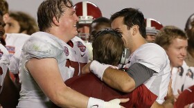 Alabama head coach Nick Saban is hugged by AJ McCarron and Barrett Jones after the BCS National Championship college football game against Notre Dame Monday, Jan. 7, 2013, in Miami. Alabama won 42-14. (AP Photo/Chris O'Meara)