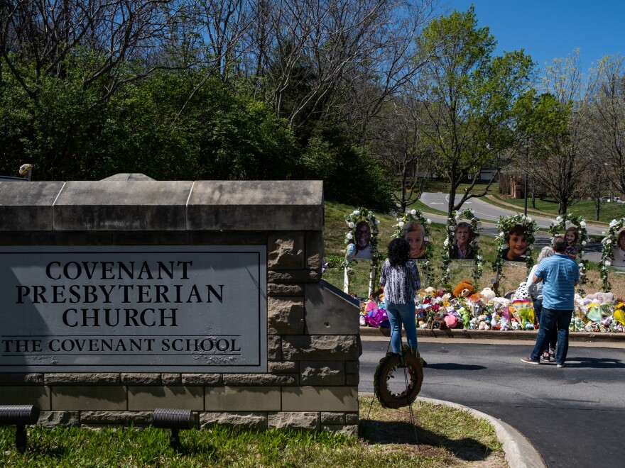 People visit a makeshift memorial at the entrance of The Covenant School on April 1, 2023 in Nashville, Tennessee.