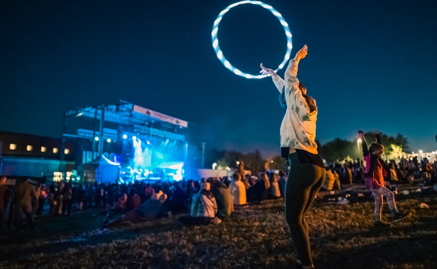 As the sun went down, hula hoops lit the audience of the Grand Rapids Riverfest 2022.