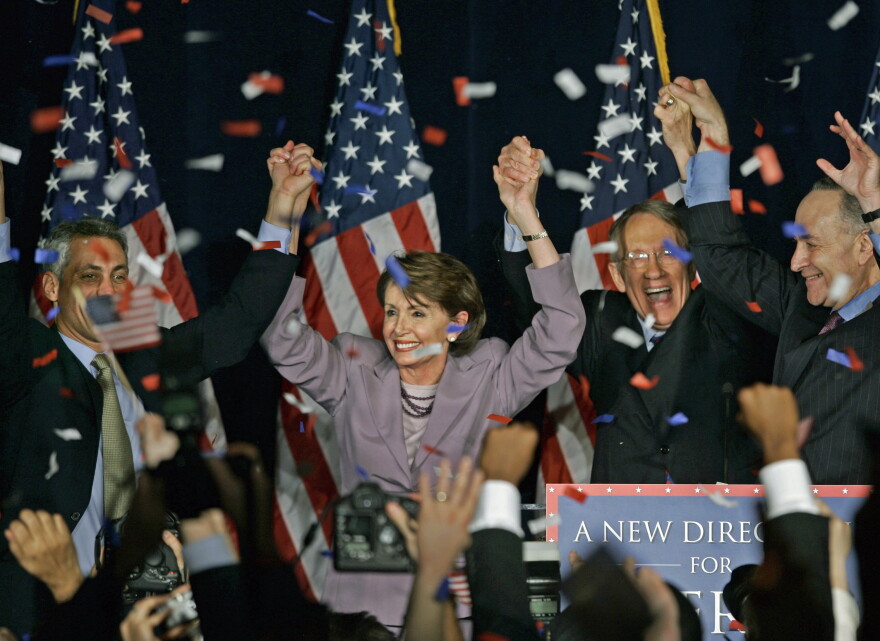 FILE - In this Nov. 7, 2006, file photo, Rep. Nancy Pelosi, D-Calif., center, celebrates with fellow Democrats at an election-night rally in Washington. At left, chairman of the House Democratic Congressional Campaign Committee Rep. Rahm Emanuel, D-Ill., and from right, chairman of the Democratic Senatorial Campaign Committee Sen. Charles Schumer, D-N.Y., and Senate Democratic Leader Sen. Harry Reid, D-