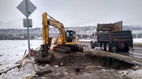 City crews repair broken water main where it crosses Beluga Slough.