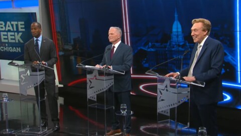 Left to right: Congressman John James, former state Attorney General Mike Cox, and businessman Perry Johnson debate in Grand Rapids on July 9, 2026.