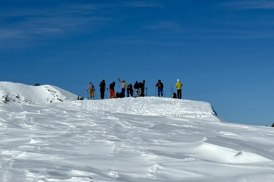 Backcountry skiers gather near the top of Pinecone Ridge on Feb. 22, 2026