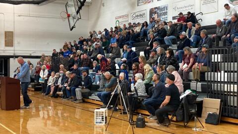 The Banks Township Board of Trustees meeting drew a crowd large enough that the meeting was moved to the gym at Ellsworth High School. (Photo courtesy of Julie Waterman)