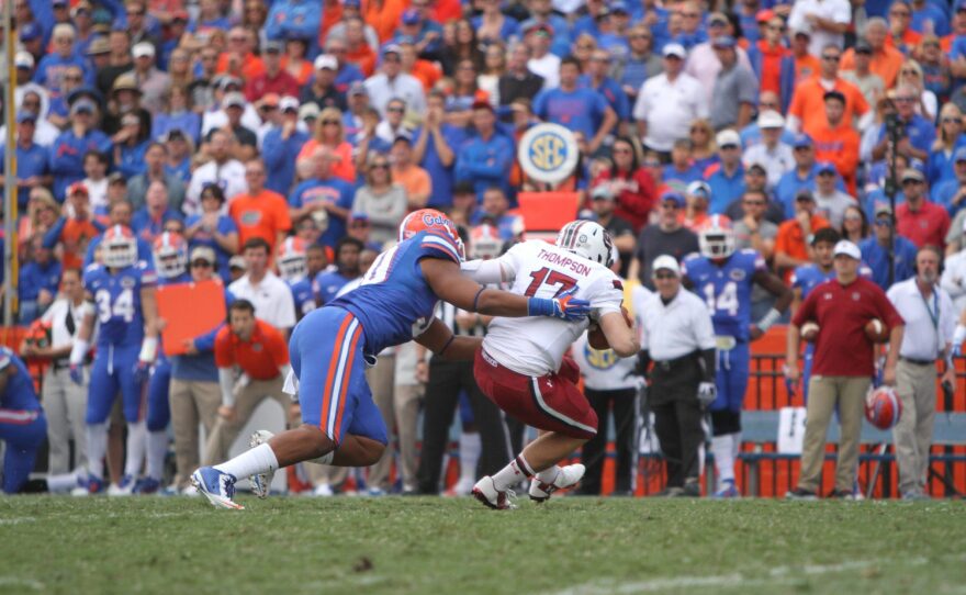 Defensive lineman Jonathan Bullard fights his way into the backfield, sacking South Carolina QB, Dylan Thompson.