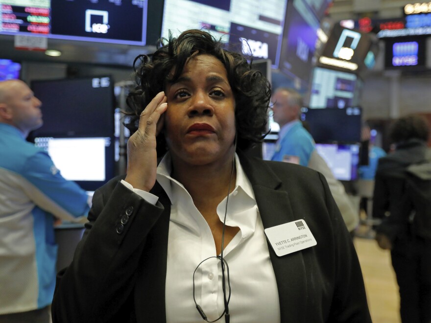 Yvette Arrington, with the New York Stock Exchange Trading Floor Operations, watches the market slide on March 9, as coronavirus fears grip the financial markets.