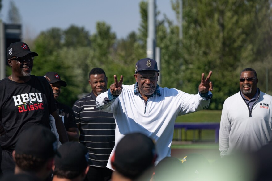 HBCU alumnus and Baseball Hall of Famer Andre Dawson (center) acts as a hitting coach during practice for the HBCU Swingman Classic.