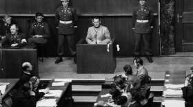Nazi leader Hermann Goering (1893 - 1946) is pictured on March 16, 1946, in the witness box at the Nuremberg War Crime Trials, where he was later sentenced to death. (Keystone/Getty Images)