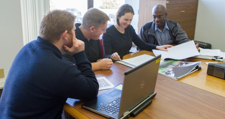 Members of the Oklahoma Department of Transportation’s engineer-in-training program look over plans for a proposed bridge December 21. ODOT submitted its budget reduction plan on time.