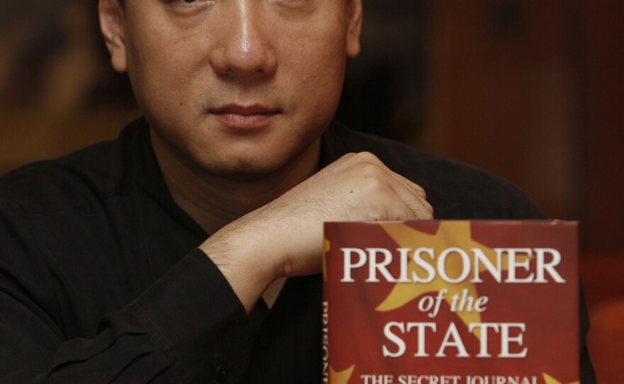 Bao Pu, shown here in 2009 with a book he edited, canceled publication in 2010 of the diary of Li Peng, China's leader during the crackdown on Tiananmen Square protesters in 1989.