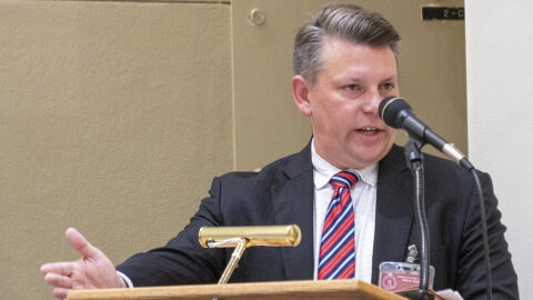 Ryan Kriegshauser, the U.S. Attorney for the District of Kansas, lauded the federal court decision blocking enforcement of a state law granting immigrant students the right to enroll at public colleges and universities at the in-state tuition rate. In this image from June 21, 2024, Kriegshauser addresses the State Objections Board.