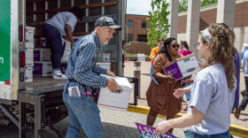 Petitioners with Missourians for Healthy Families and Fair Wages unload dozens of boxes of signatures to deliver to the Secretary of State in May.